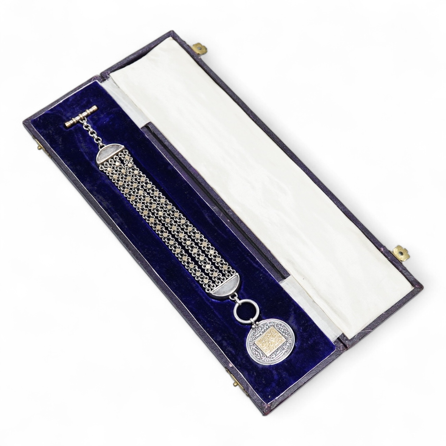 A cased Middle Eastern medallion